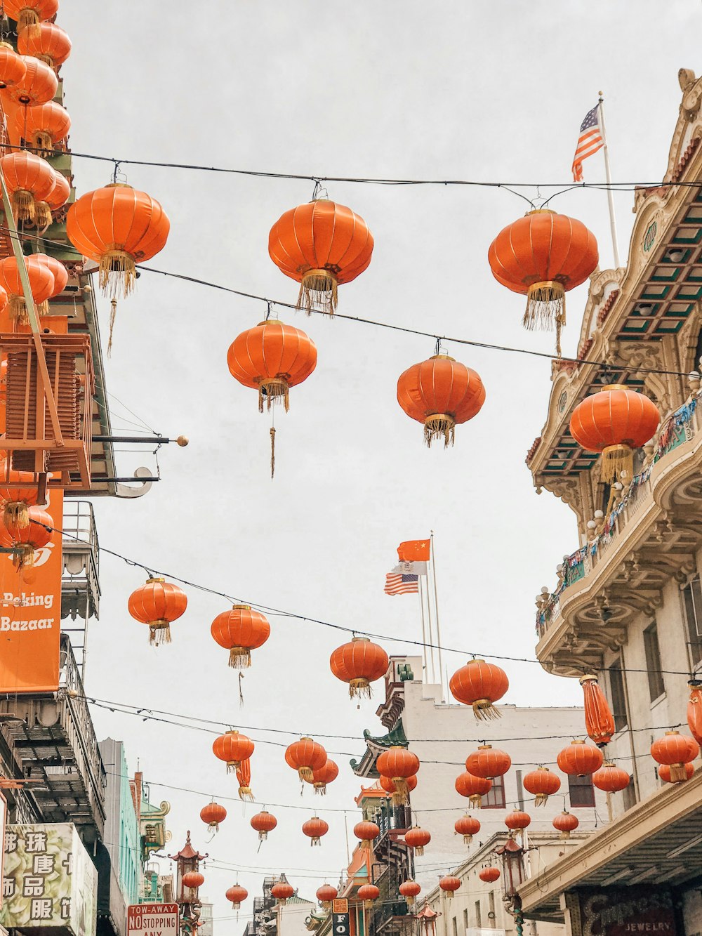 photograph of orange lanterns on streets