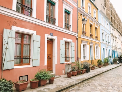 Exterior photo of a colorful Copenhagen townhouse in a quiet street