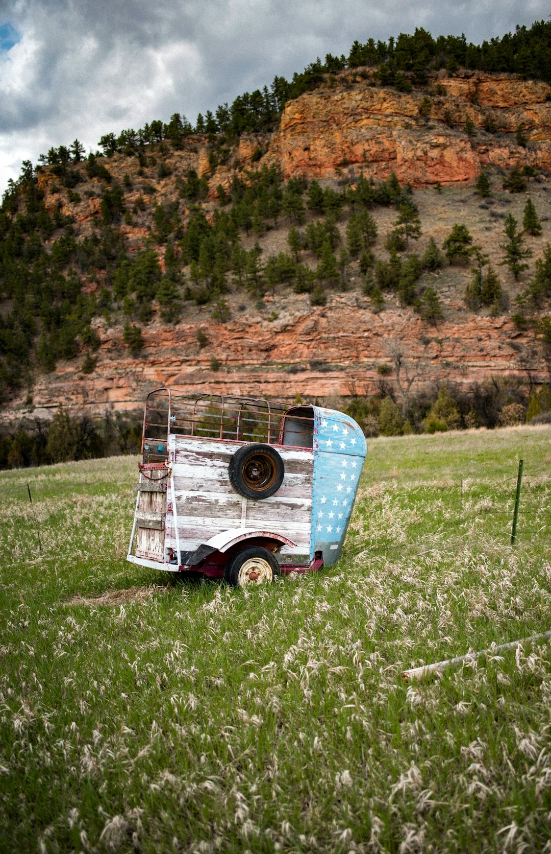 brown wooden trailer on grass field