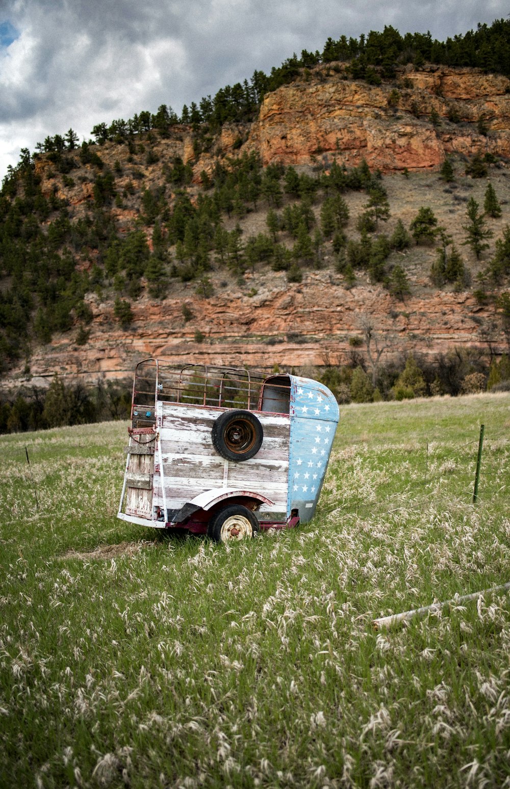 brown wooden trailer on grass field