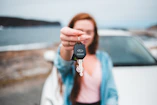 focus photography of black vehicle key