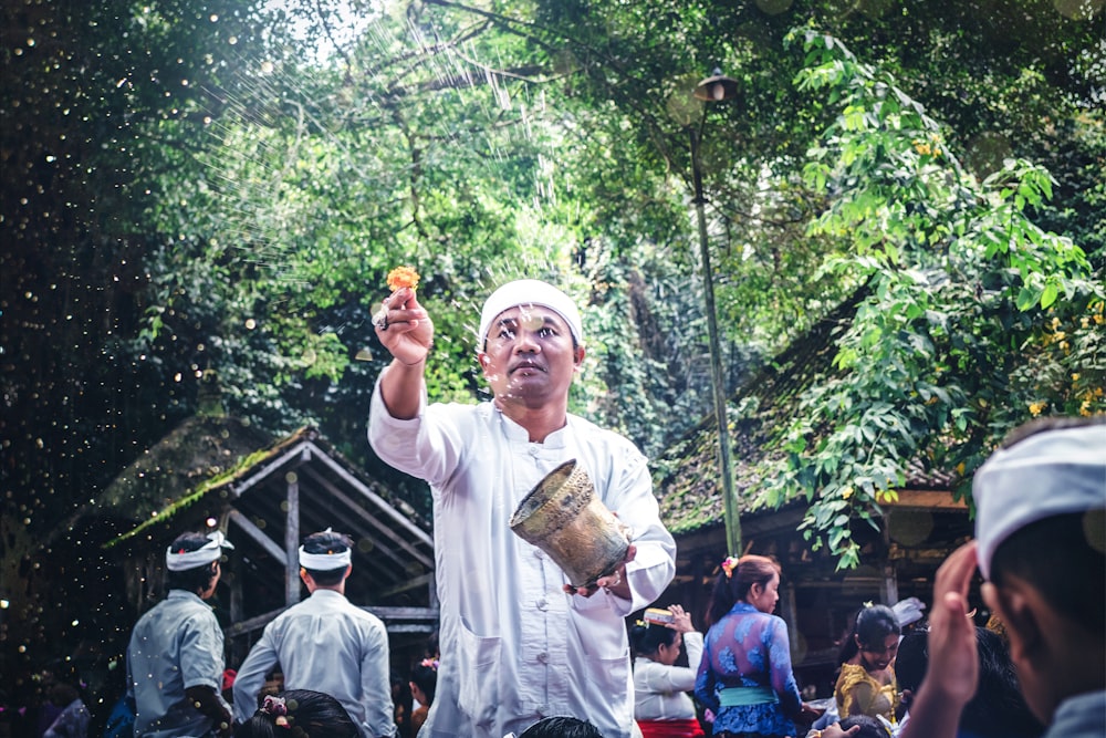 man holding brown pot