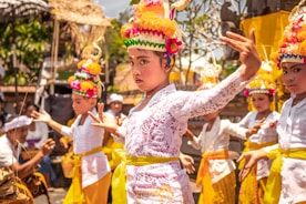 girl wearing yellow and white floral dress