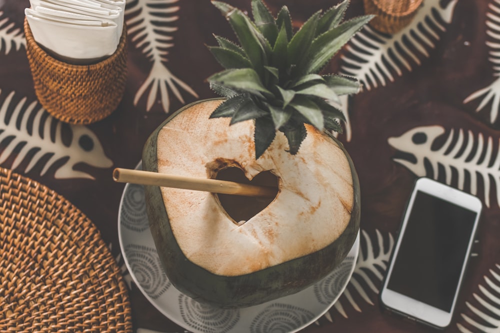 green coconut on white ceramic plate