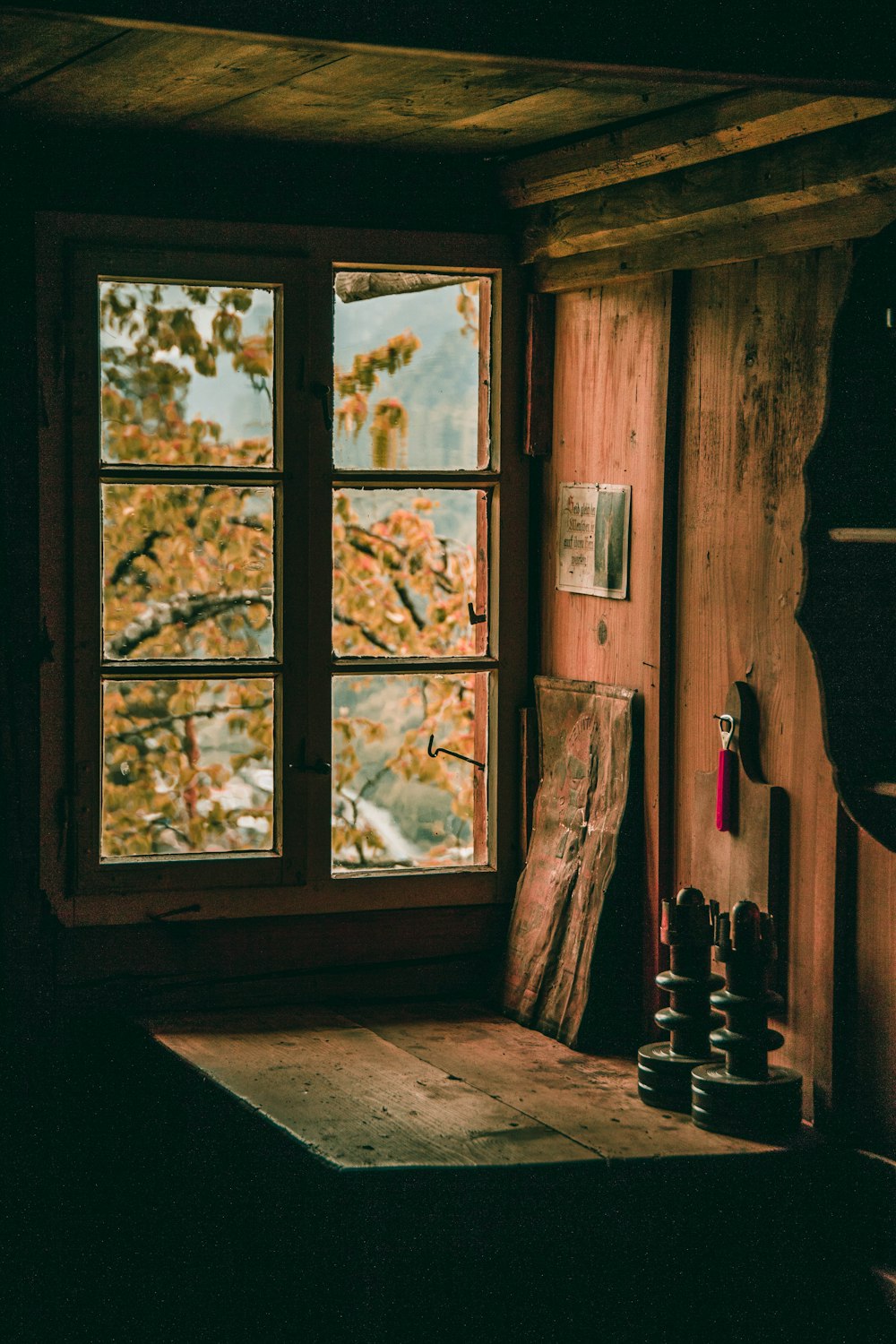 brown wooden table near window during daytime