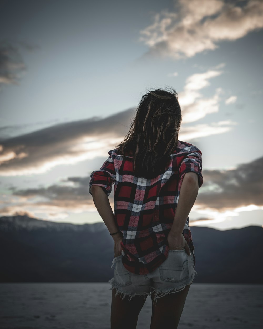 woman wearing black, red, and white plaid shirt