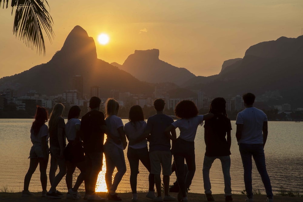 people standing near body of water