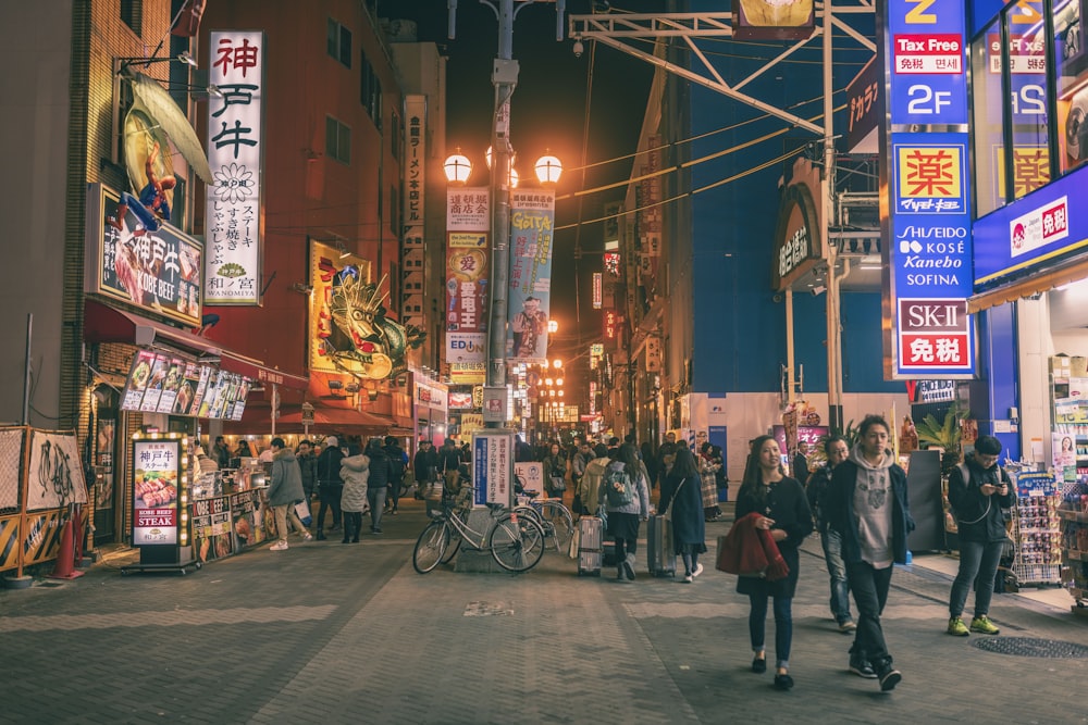 couple walking beside building