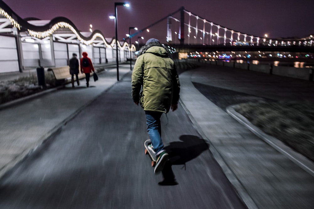 man walking near fence