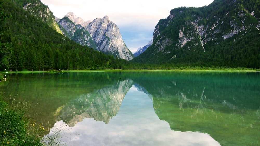 body of water near mountains