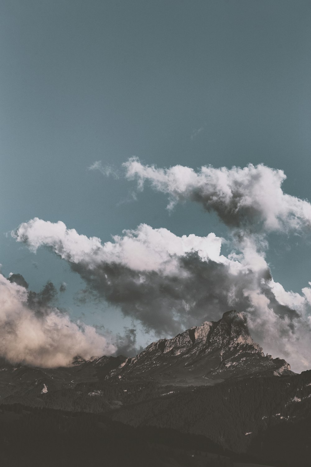 mountain and clouds during day