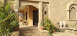 Welcoming guest house entrance with traditional South Indian architectural elements.