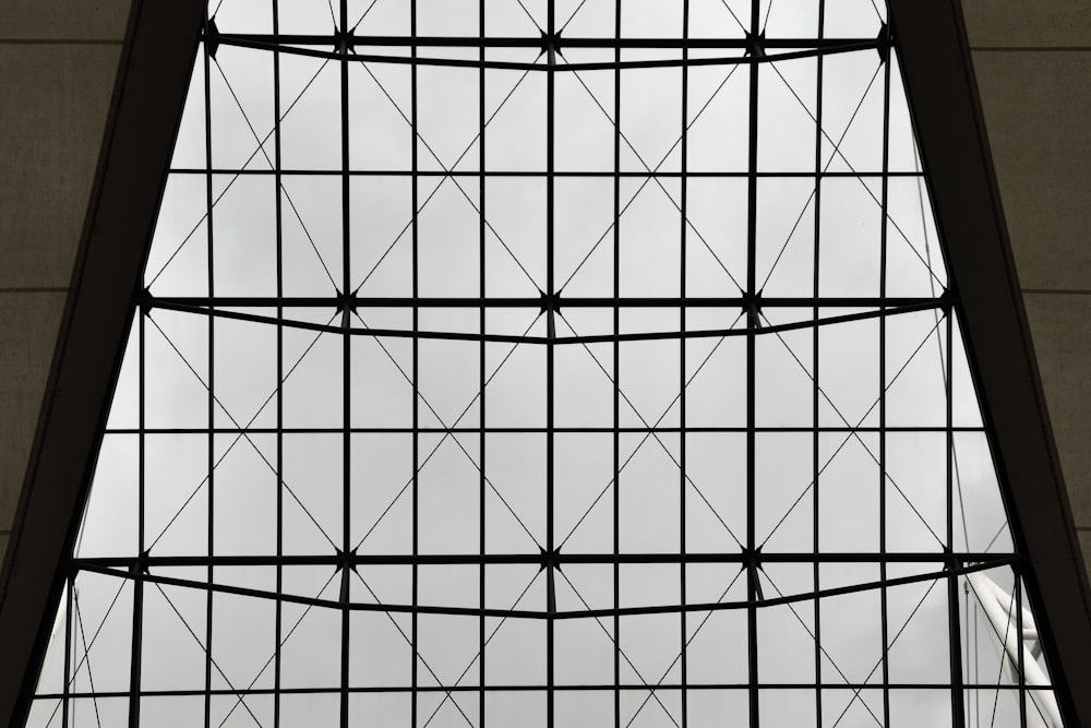 a view of the sky through a window in a building
