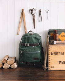 green backpack near wall