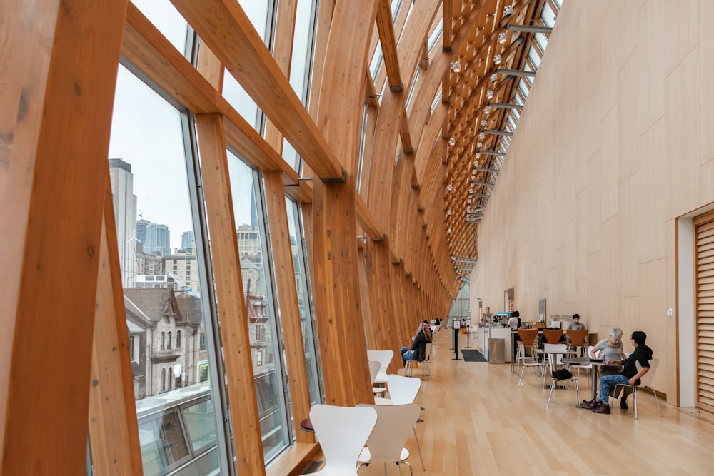 people inside building with glass walls