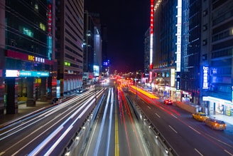time lapse photography of vehicles and city during daytime