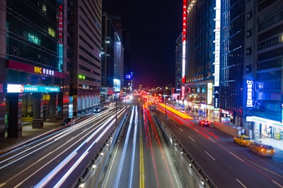 time lapse photography of vehicles and city during daytime