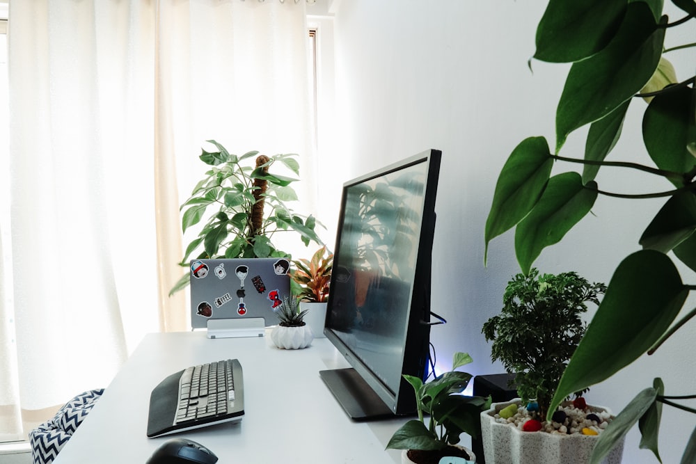 black computer monitor on desk