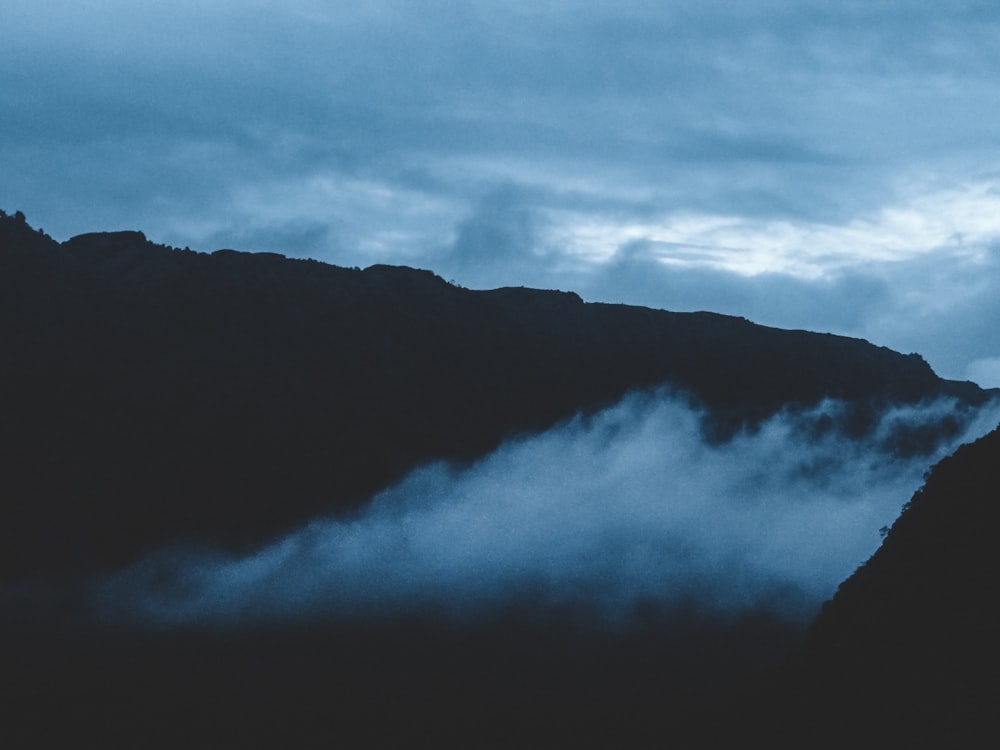 mountain covered with fogs