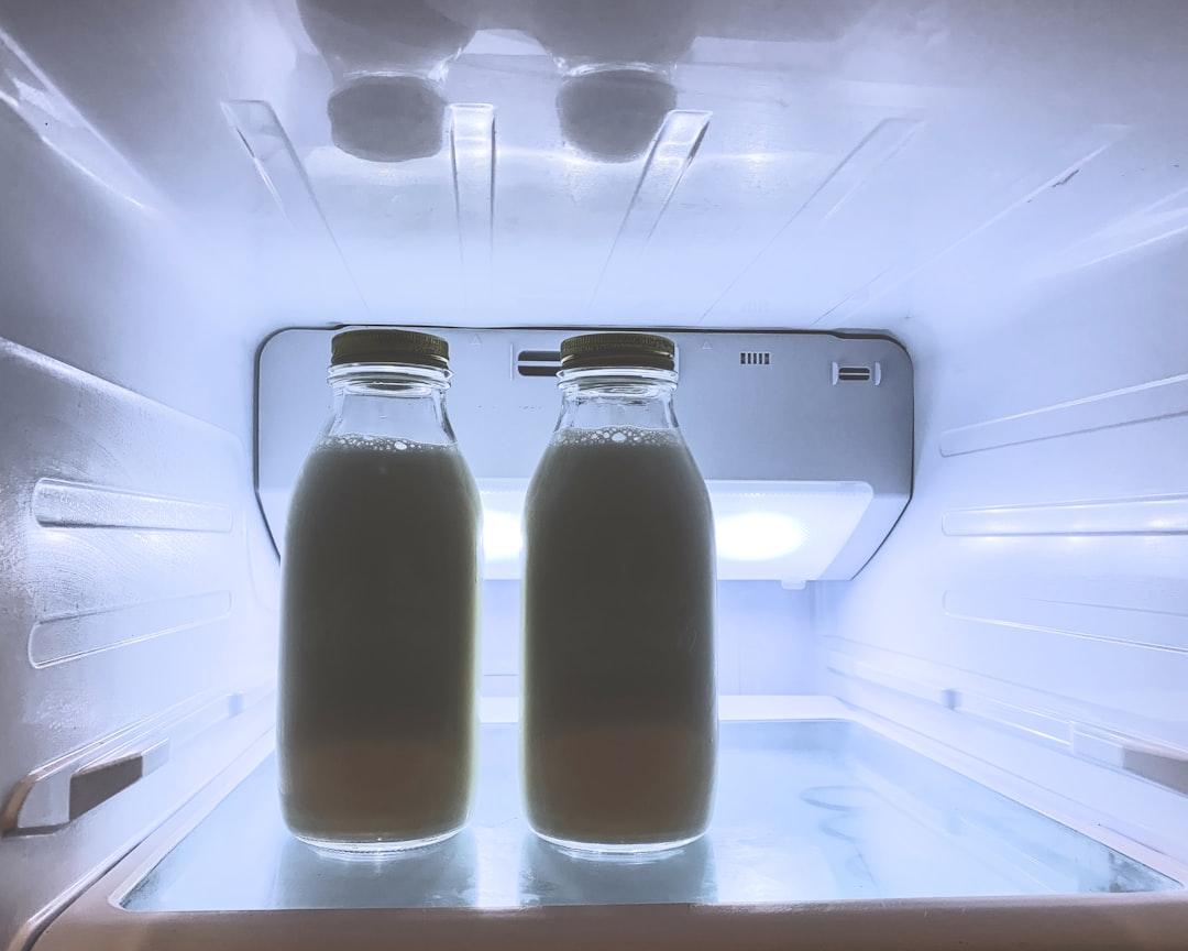  two jar of milk bottles refrigerator