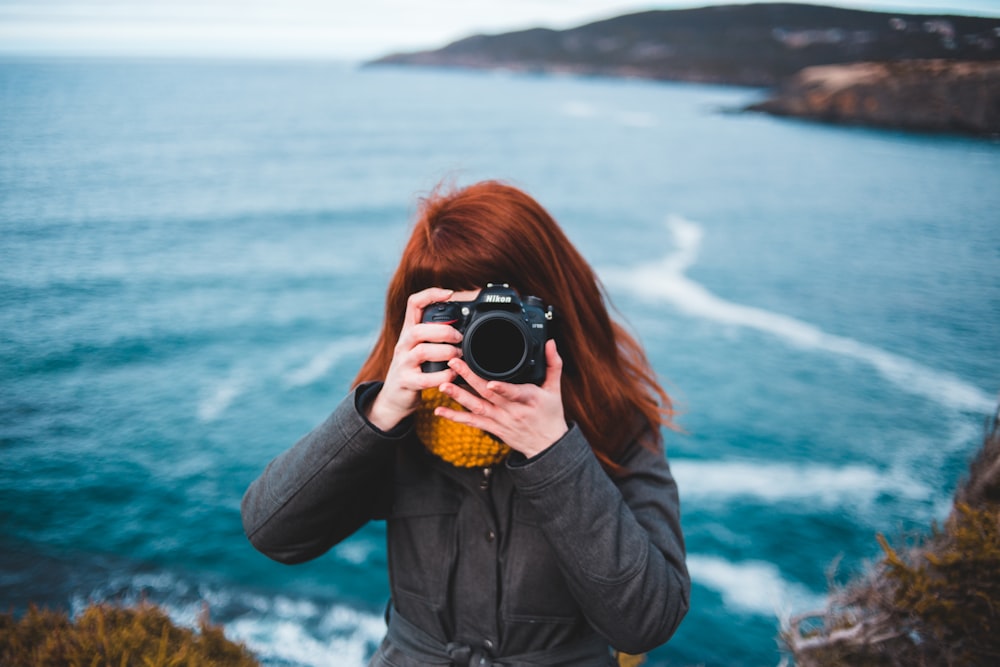 woman taking photo photography