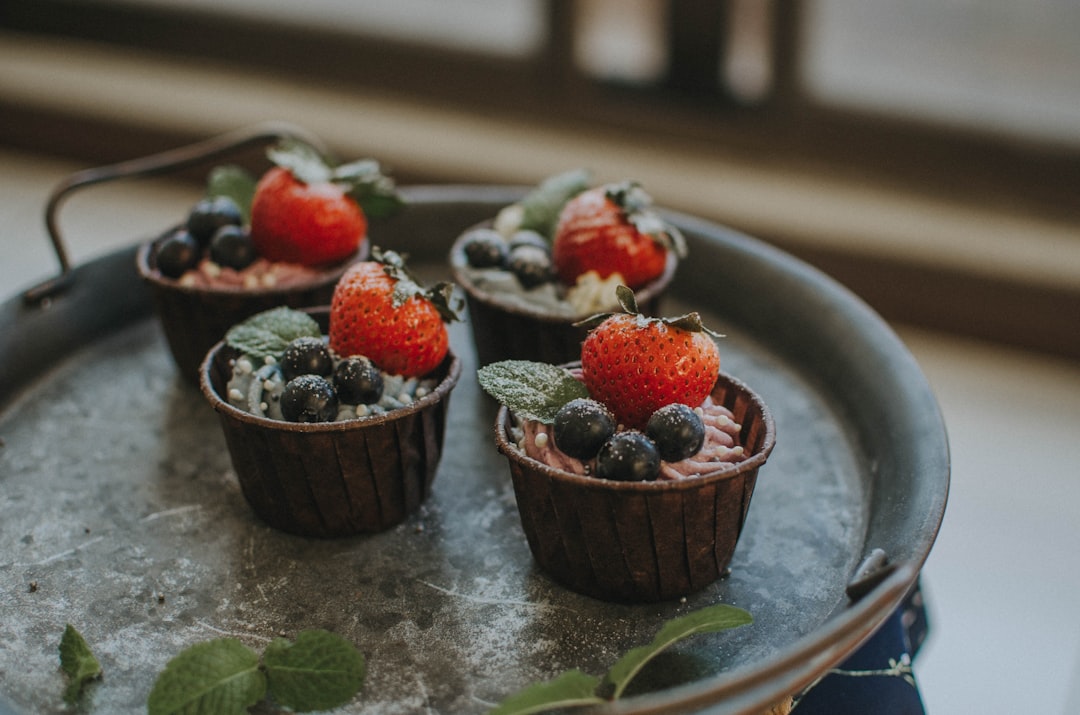 strawberry cupcakes on black tray