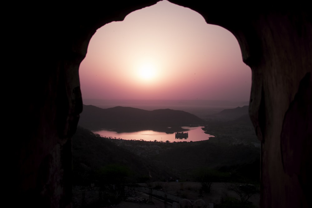 sunrise at the mountain through window