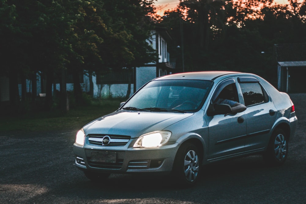 gray Opel sedan park outside during golden hour