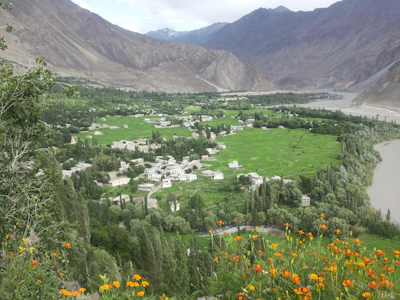 The lush green oasis of Ourika Valley with traditional Berber houses.