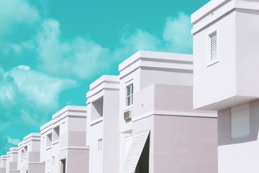 white houses under aquamarine sky