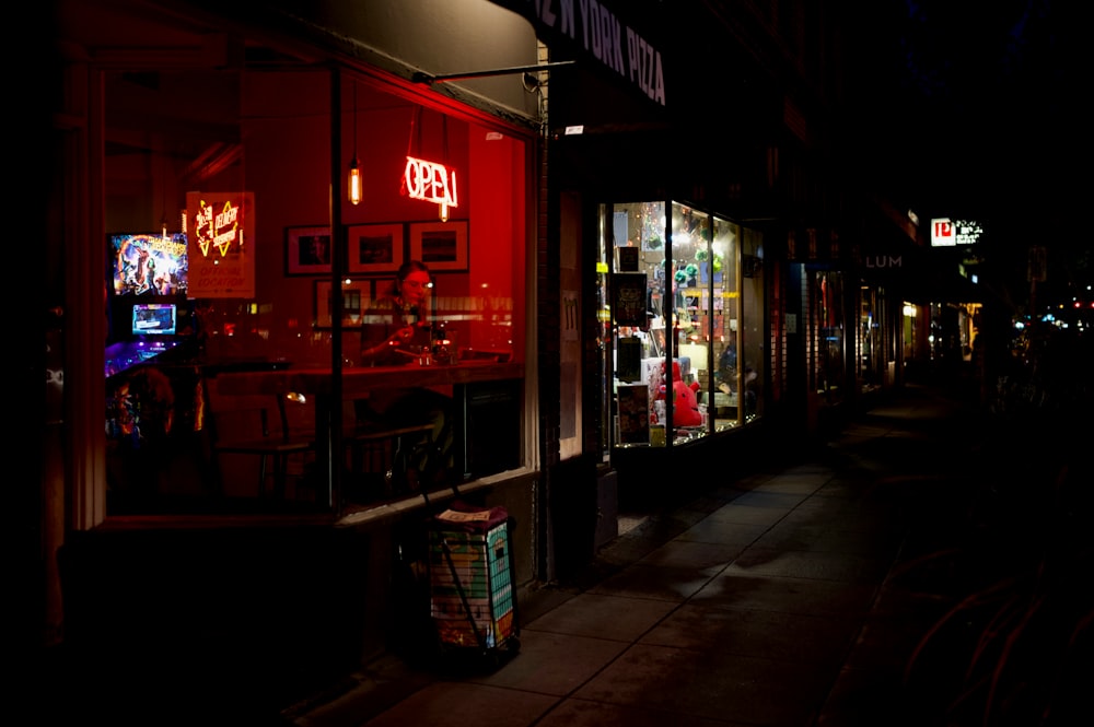 lighted stores beside street