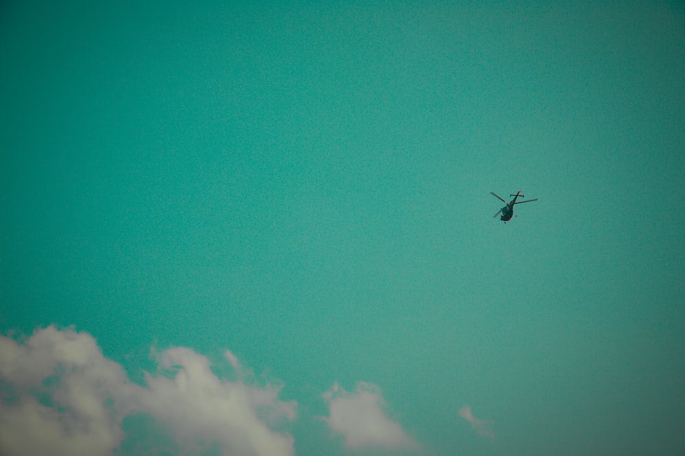 black helicopter in flight