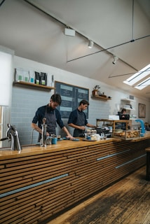 two men standing at counter