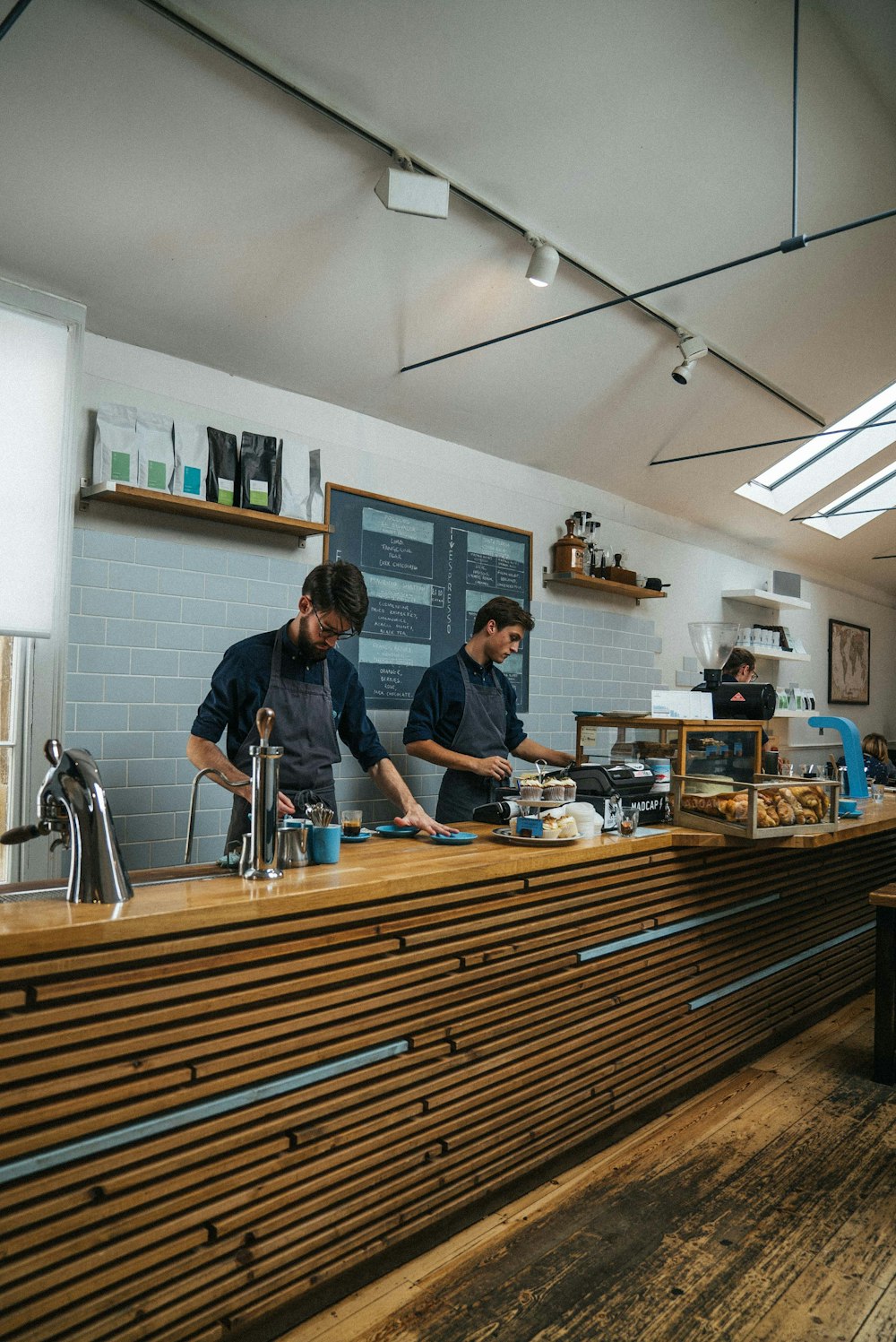 two men standing at counter