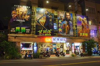 four assorted-title movie billboard during night time