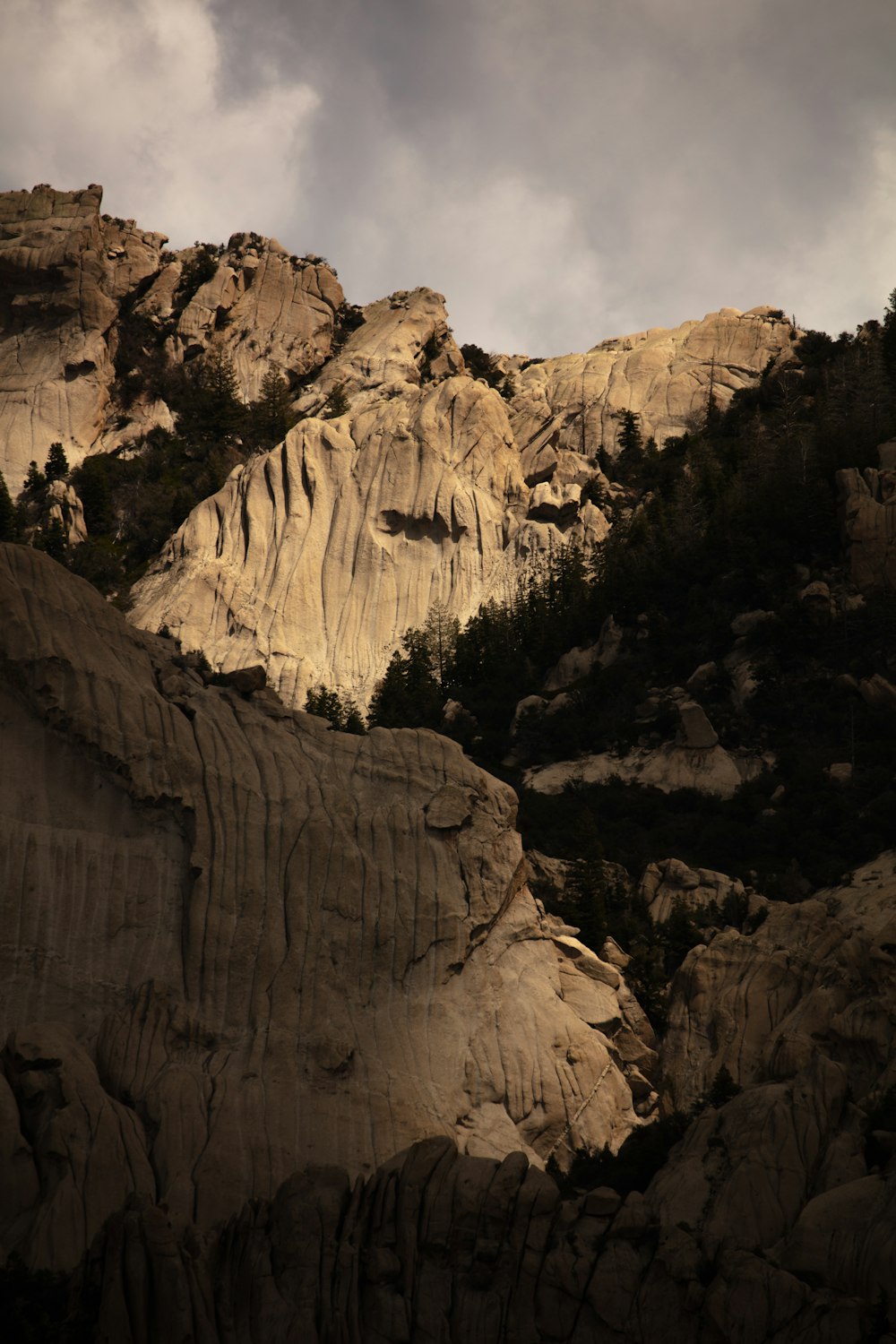 rocky mountain under gray sky