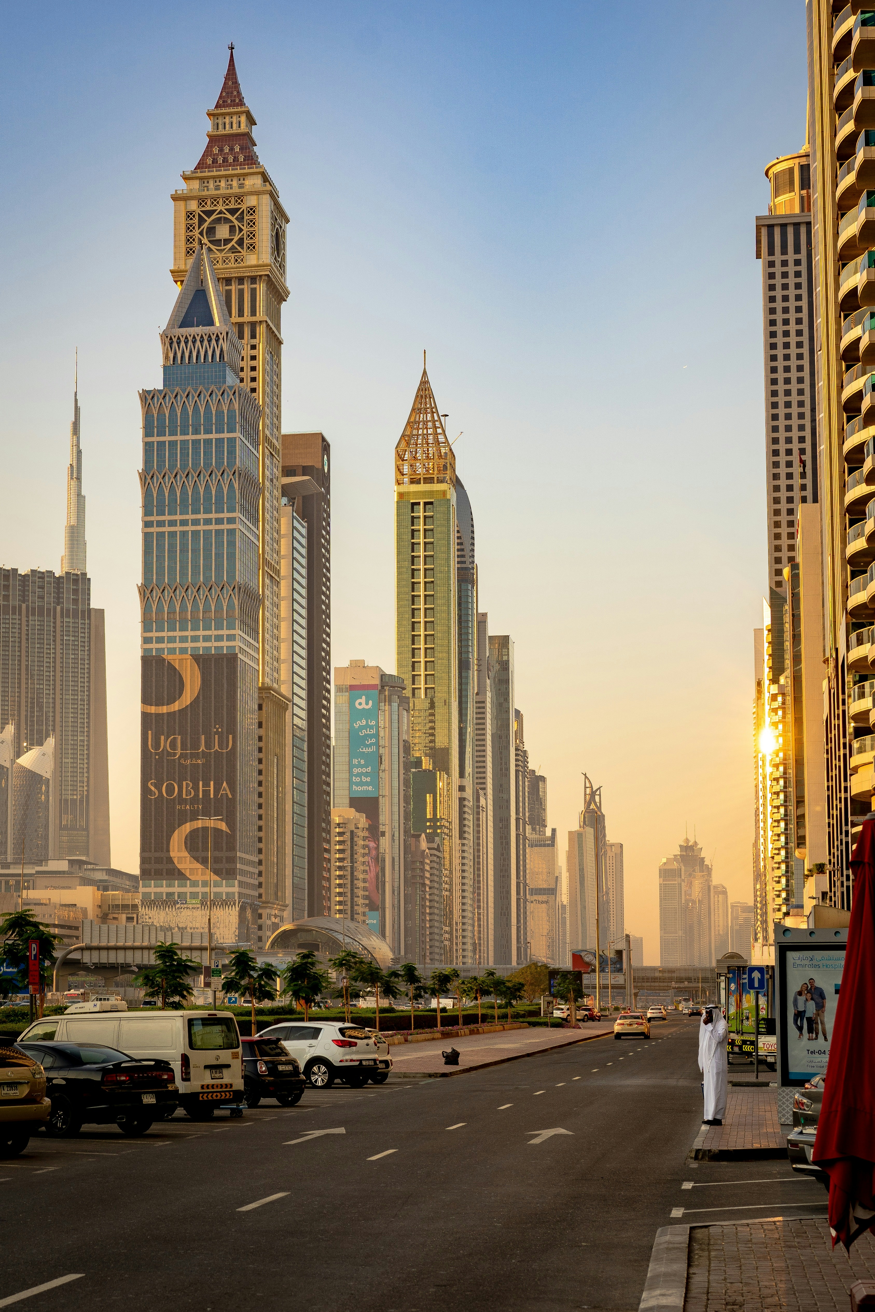 Man in casual luxury attire, Dubai skyline background, confident posture