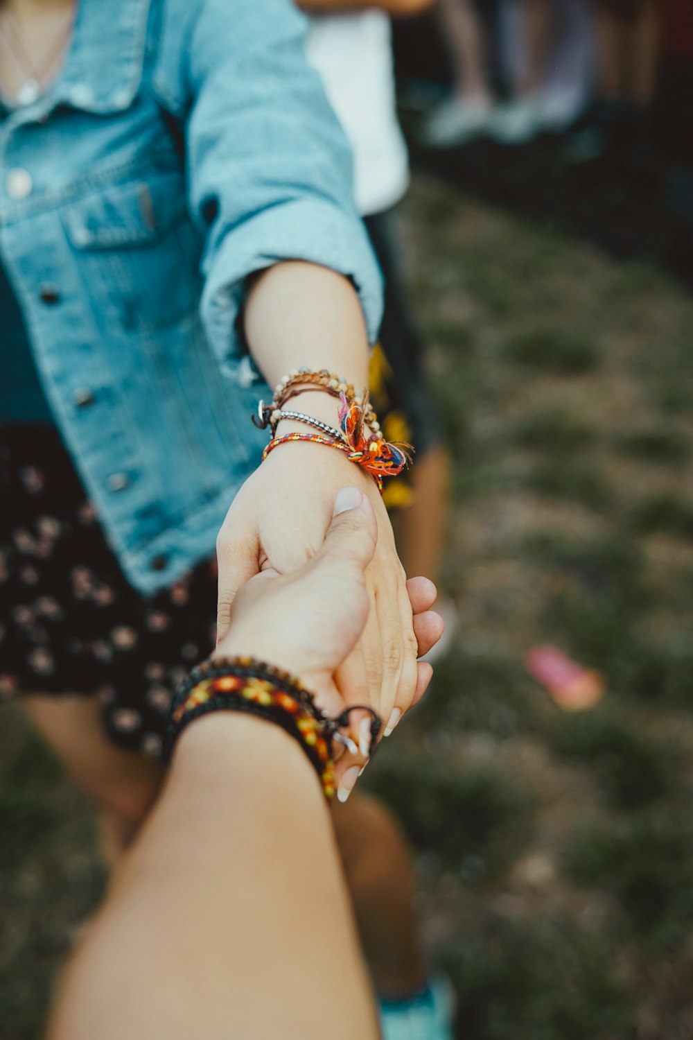 person holding hand of woman