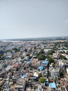 Aerial view of diverse real estate properties in a vibrant urban area.