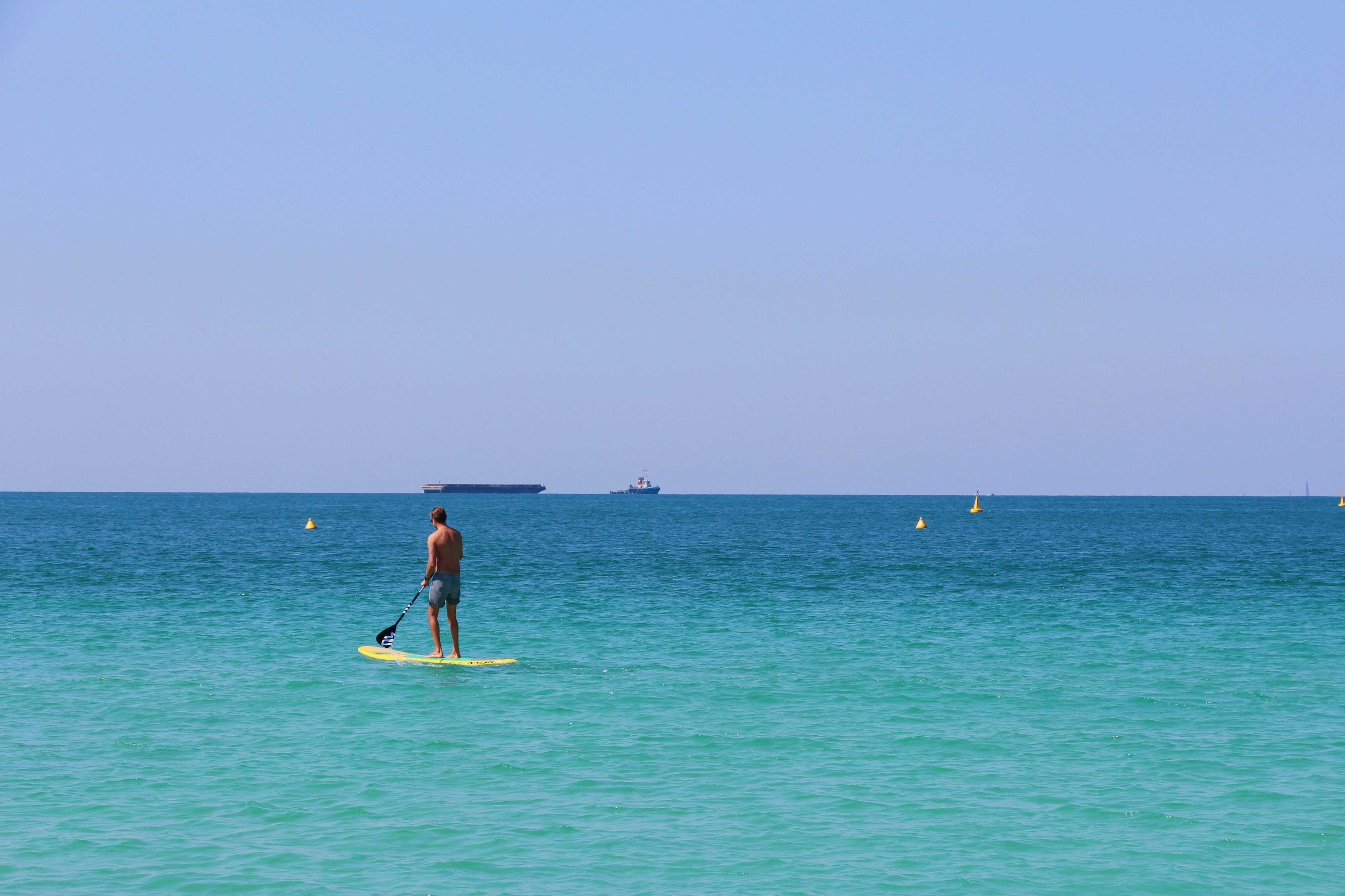 man standing on the surfboard