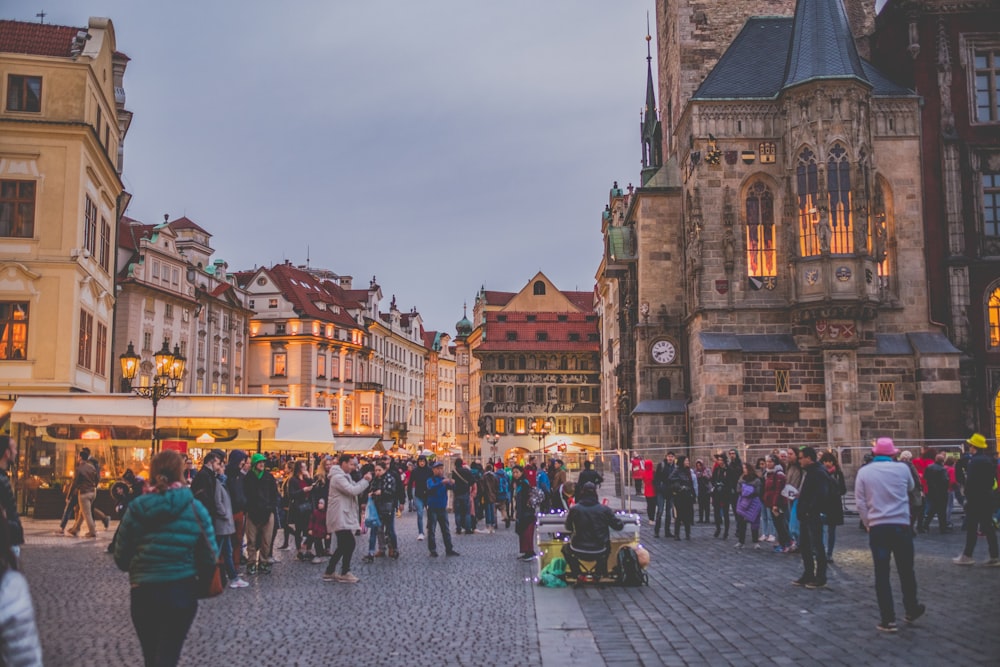 people surrounded by concrete houses