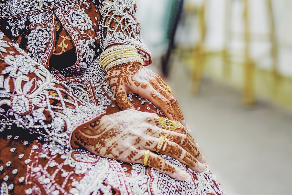 woman with red mehndi tattoo