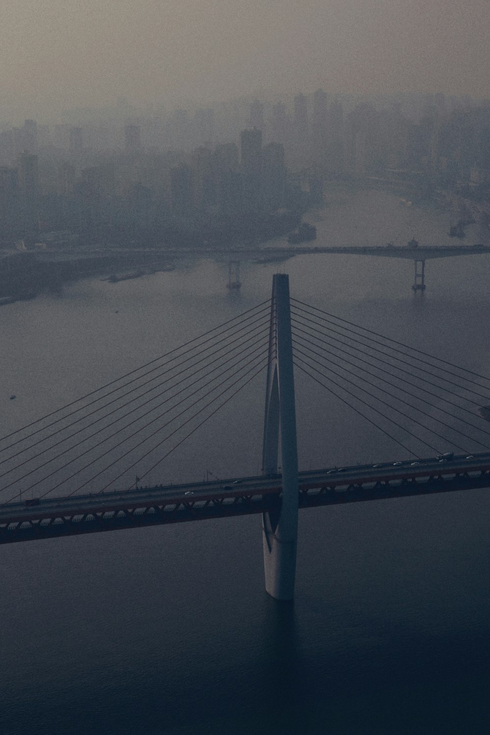 high-angle photography of bridge during fogs
