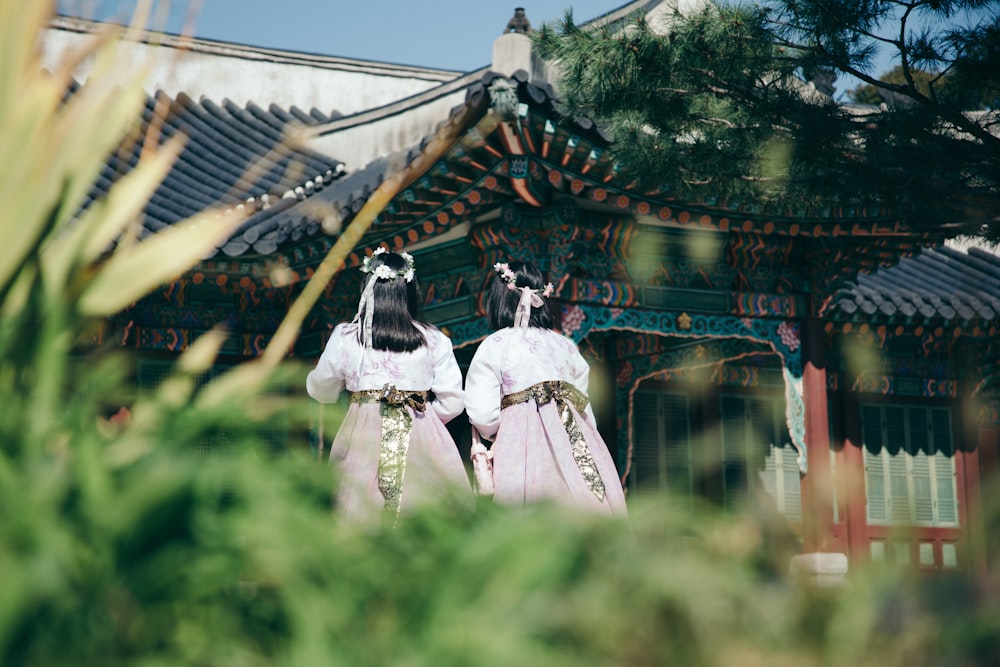 two persons facing temple