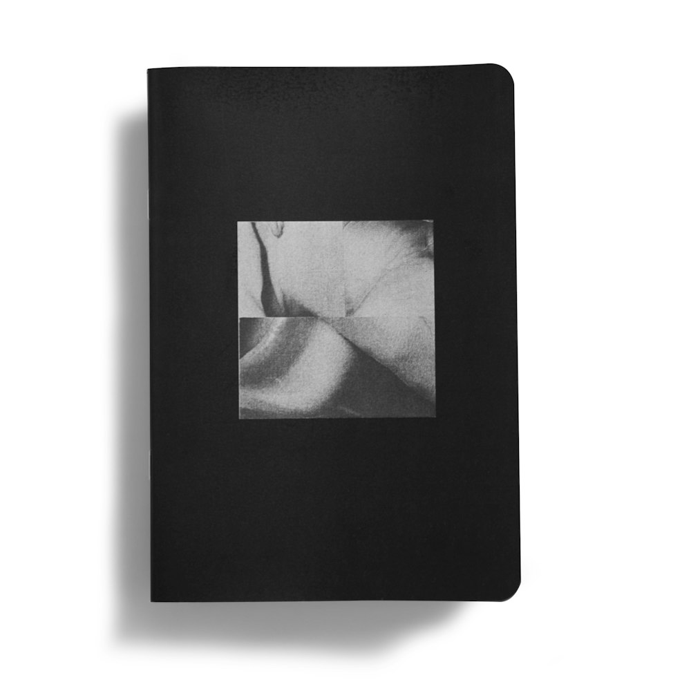 a book with a black cover and a white photo