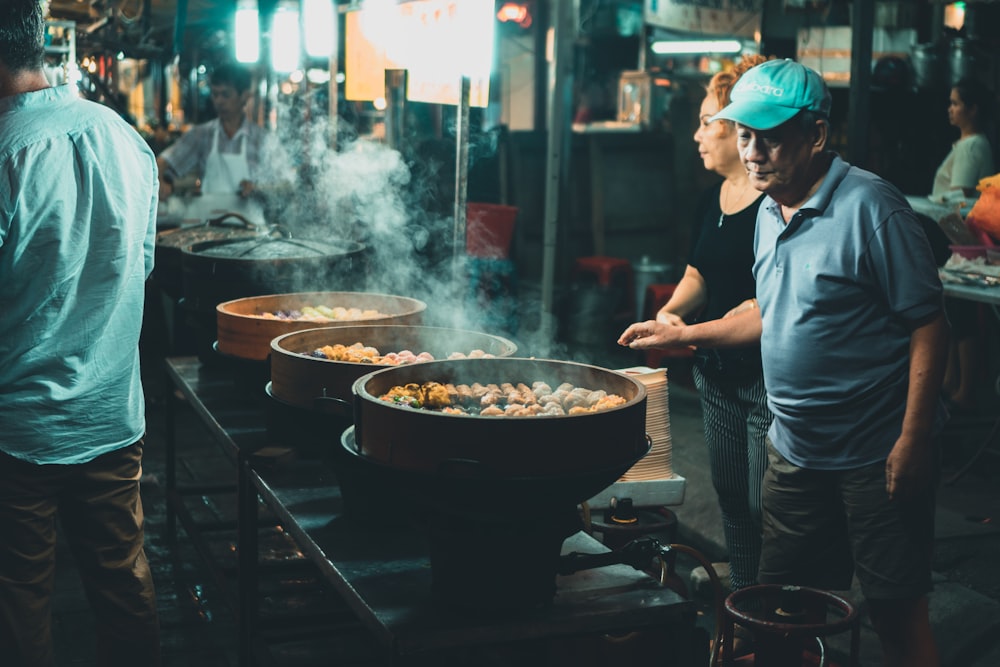 man near grilling meats