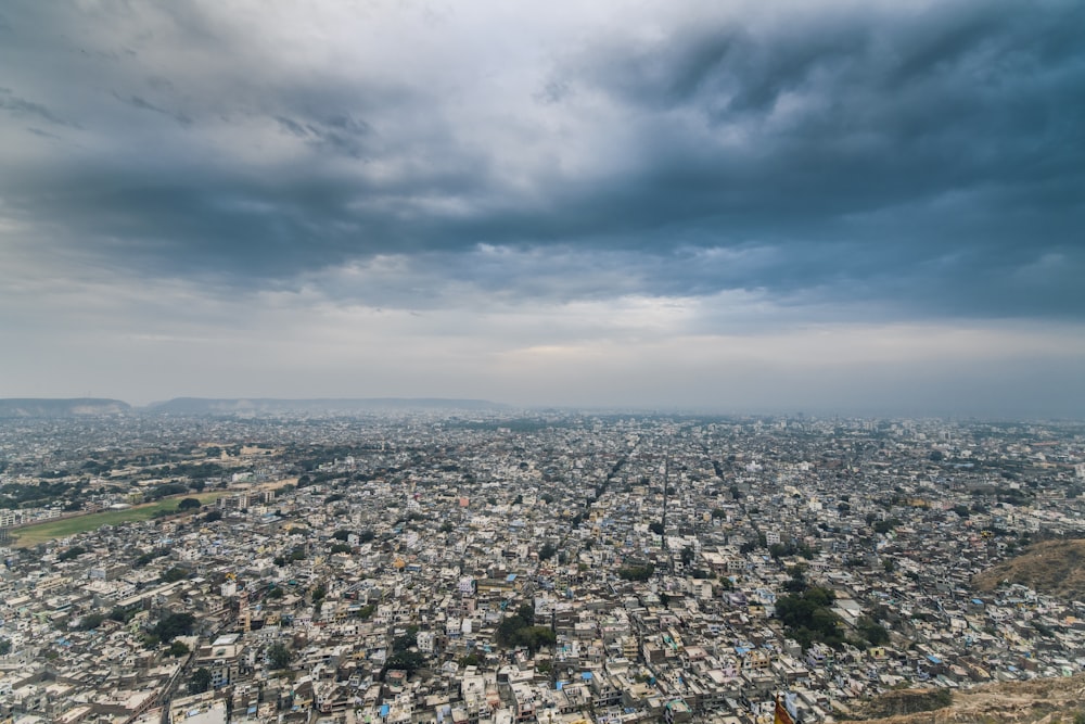 aerial photography of a city over dramatic sky