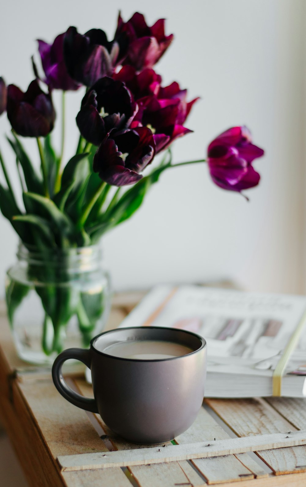 cup near tulip flowers