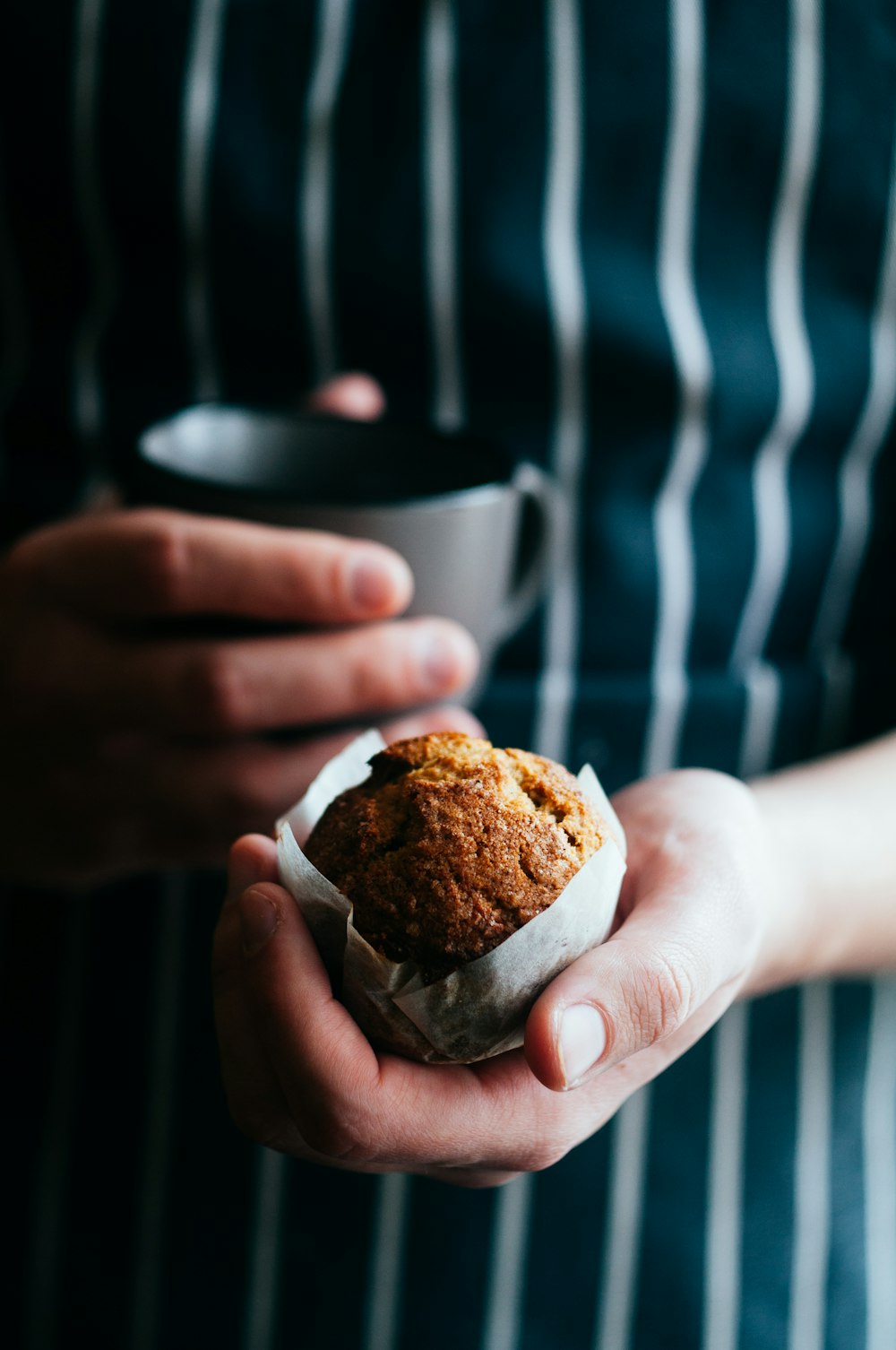 person holding a muffin