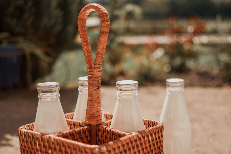 Glass milk bottles in a basket